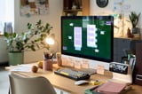 Creative workspace with computer and design tools